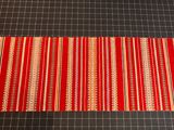 red and white striped table runner on a black table