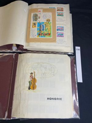two books that are open on a black table