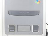 an image of a nintendo super nintendo entertainment system with a controller
