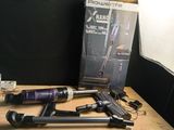a box of vacuums sitting on a table next to a box of hair dryers