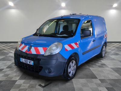 a blue van with red and white stripes parked in a room