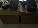 two phones sitting on top of a box in a room