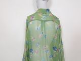 green floral blouse with long sleeves on mannequin mannequin mannequin mannequin mannequin mannequin mannequin mannequin mann