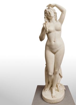 an image of a statue of a woman holding a flower in her hand