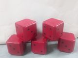 six red dice sitting on top of each other on a table