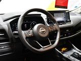 a steering wheel and dashboard of a car in a car showroom
