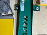 a picture of a green and yellow machine on a floor