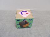 a small box with a piece of paper on top of it
