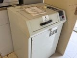 a white machine that is sitting in the corner of a room