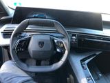 a close up of a steering wheel and dashboard of a car