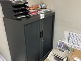 many boxes and a printer on the floor in this room