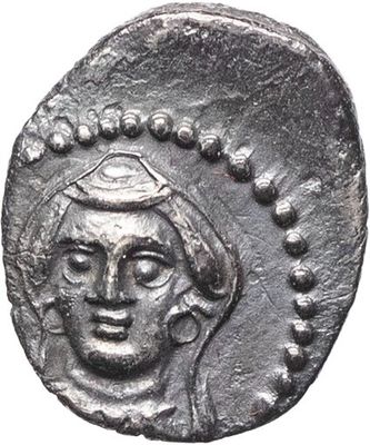 a silver coin with a man ' s face on it