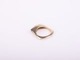 a gold ring on a white background