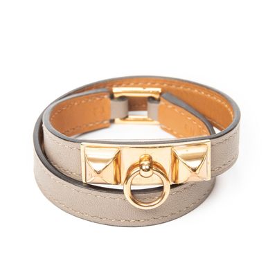 a close up of a bracelet on a white background