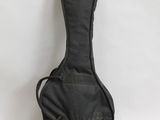 a black guitar case sitting on top of a white surface