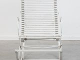 an image of a white rocking chair in a white room