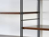 a black and wood shelving with three shelves on each side
