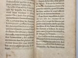 a book open to a page of text on a table