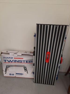 a black and white striped door next to a box of tools