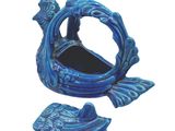 blue ceramic fish shaped mirror with a fish on it ' s back