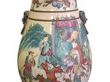 a vase with a painting on it on a white background