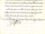 un vieux document écrit posé sur une table