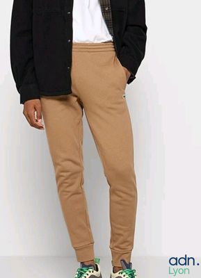 a man that is standing up wearing a jacket and pants