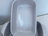 two dishes that are sitting on a counter