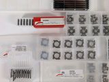 many different types of screws and nuts in this box