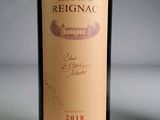 a bottle of wine that is sitting on a table