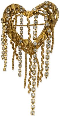 an image of a heart shaped brooch with chains hanging from it