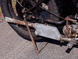 an old motorcycle that is parked on the side of the road