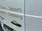 a white van that is parked on the side of the road