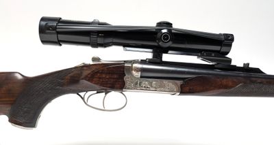 a close up of a rifle on a white background with a scope