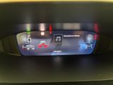 the dashboard of a car with a digital display on it