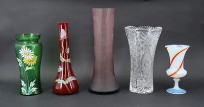 four different vases sitting next to each other on a table