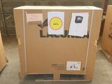 a cardboard box with a sticker on it sitting on a pallet