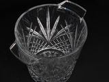 a close up of a glass bowl on a black background