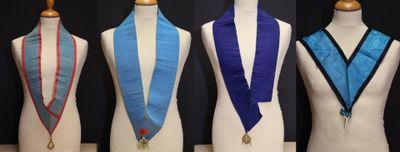 four different types of sashs on a mannequin stand