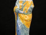 an image of a ceramic figurine of a woman holding a child