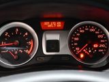 a close up of a car dashboard with a speedometer and gauges