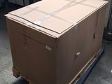 a large cardboard box on a pallet in a garage