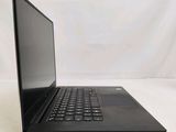 the back of a laptop computer sitting on top of a white table