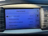 the dashboard of a car with a blue screen displaying information