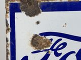 a blue and white sign with the word ford on it