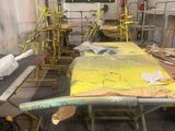 a yellow surfboard sitting on top of a table in a room