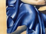 a painting of a woman holding a guitar in a blue dress
