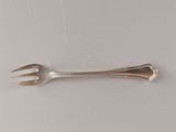 a fork and a spoon on a white surface