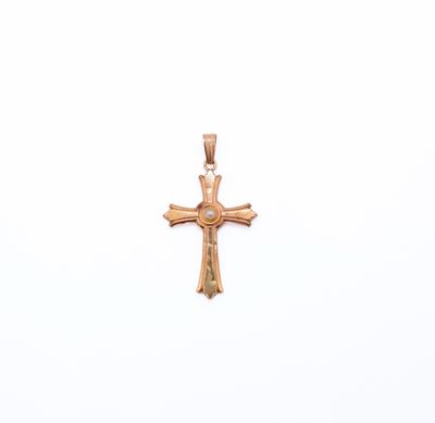 a close up of a gold cross on a white background