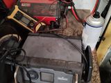 a lot of wires and tools on the table